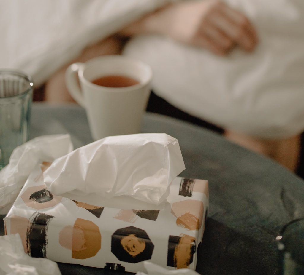 image of tea and tissue with a caregiver resting.