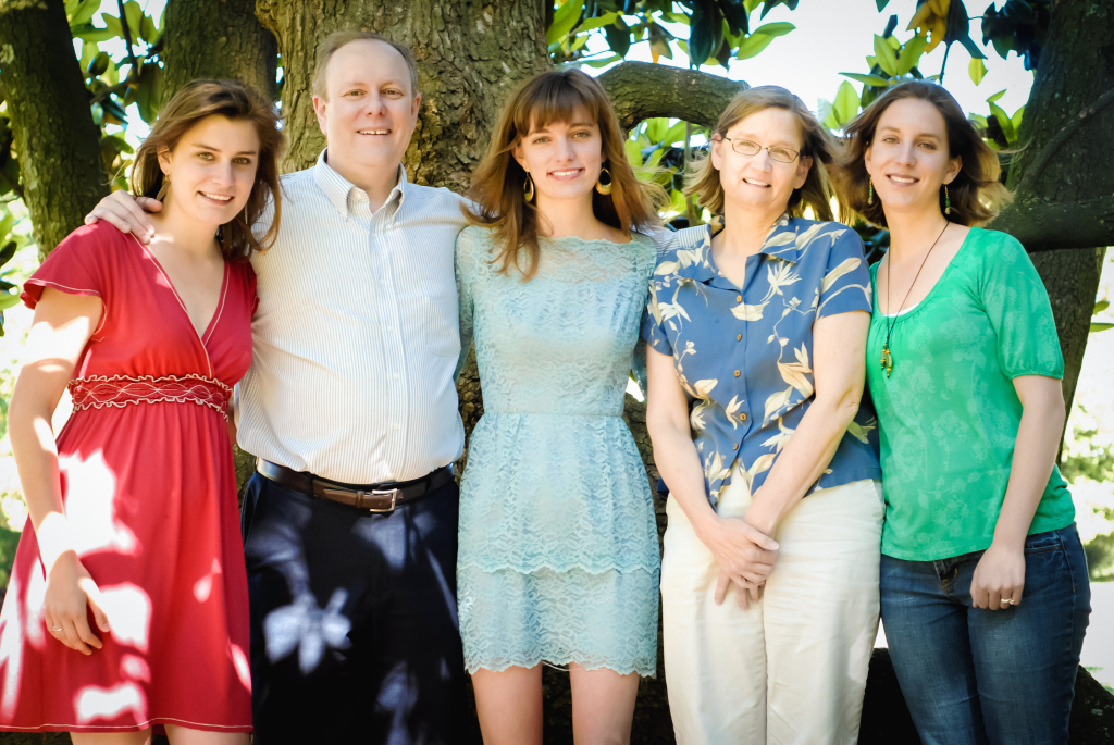 A family photo featuring caregiver Carrie, her two sisters, father, and her mother, who is facing Alzheimer's disease