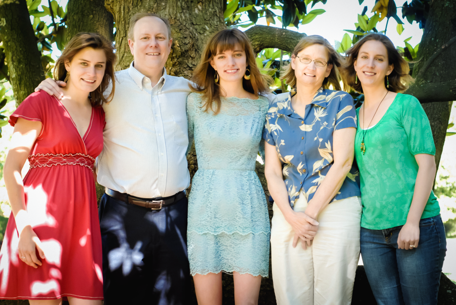 A family photo featuring caregiver Carrie, her two sisters, father, and her mother, who is facing Alzheimer's disease