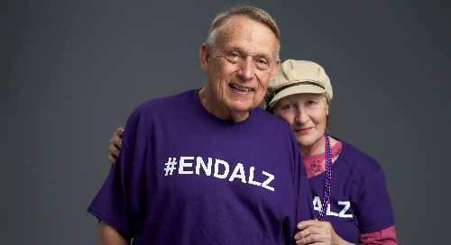 A caregiver husband posing with his wife Elaine, who is facing Alzheimer's disease