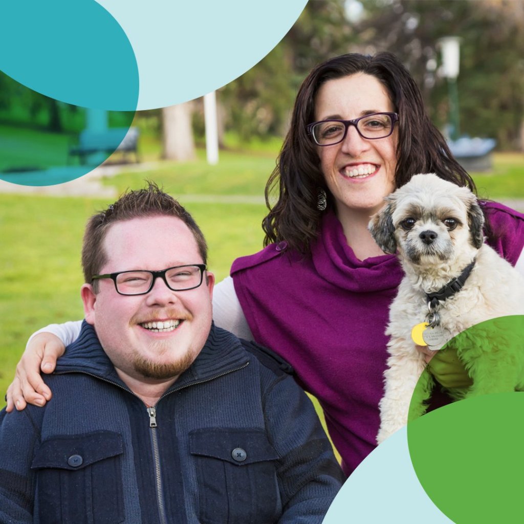 Caregivers share smiles outdoors with their beloved dog