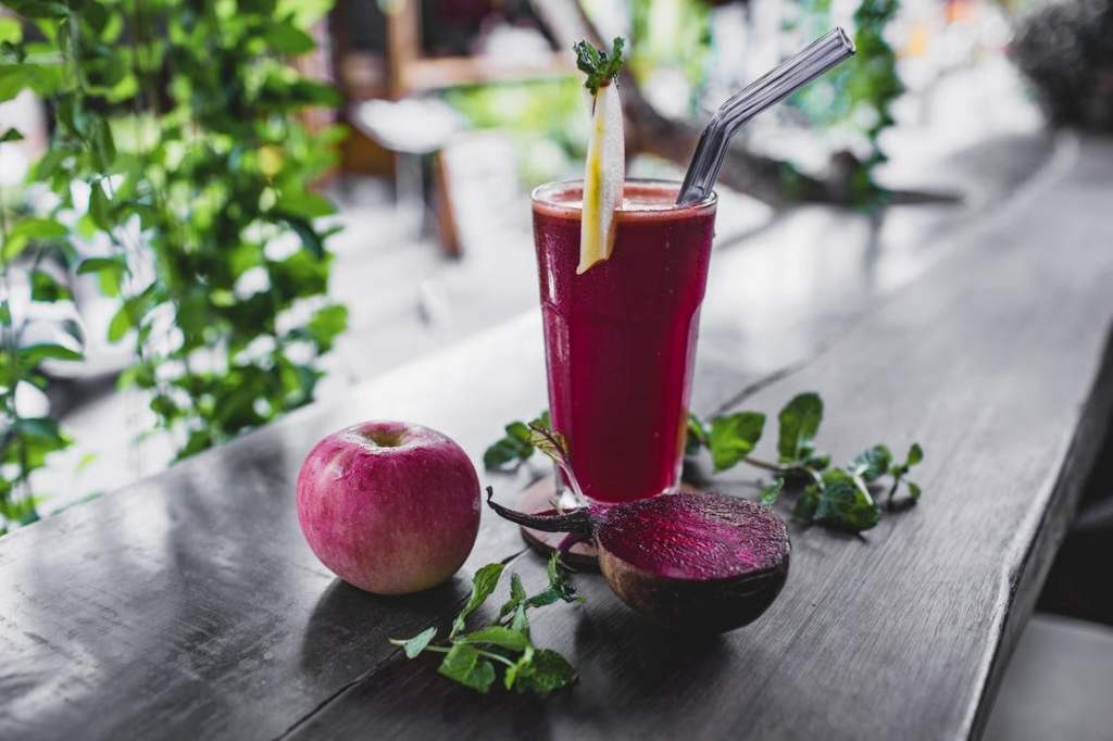 A vibrant red juice made from beets and apples
