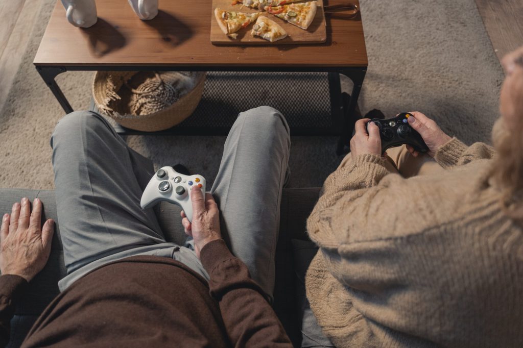 A picture looking down on an elderly couple playing video games together