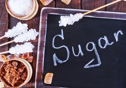 A chalkboard with the word "sugar" written on it