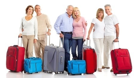 Three couples posing with their luggage