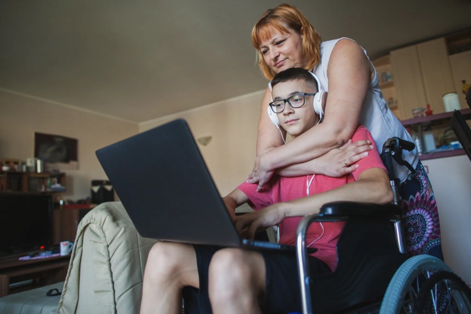 A caregiver caring for a child with disabilities.