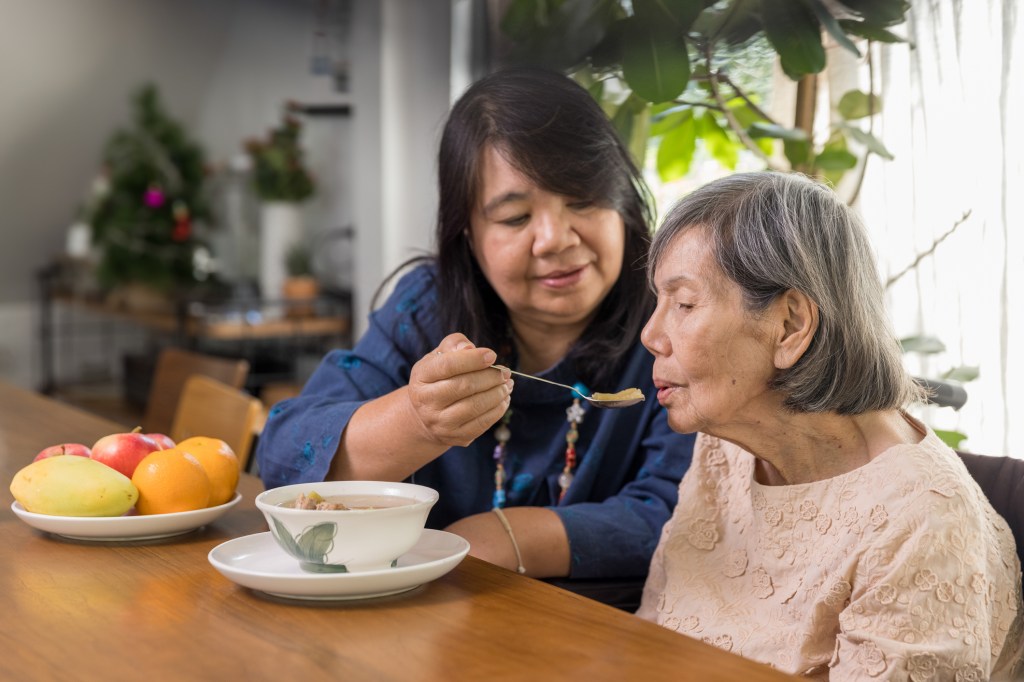 A caregiver and her mother sharing a moment