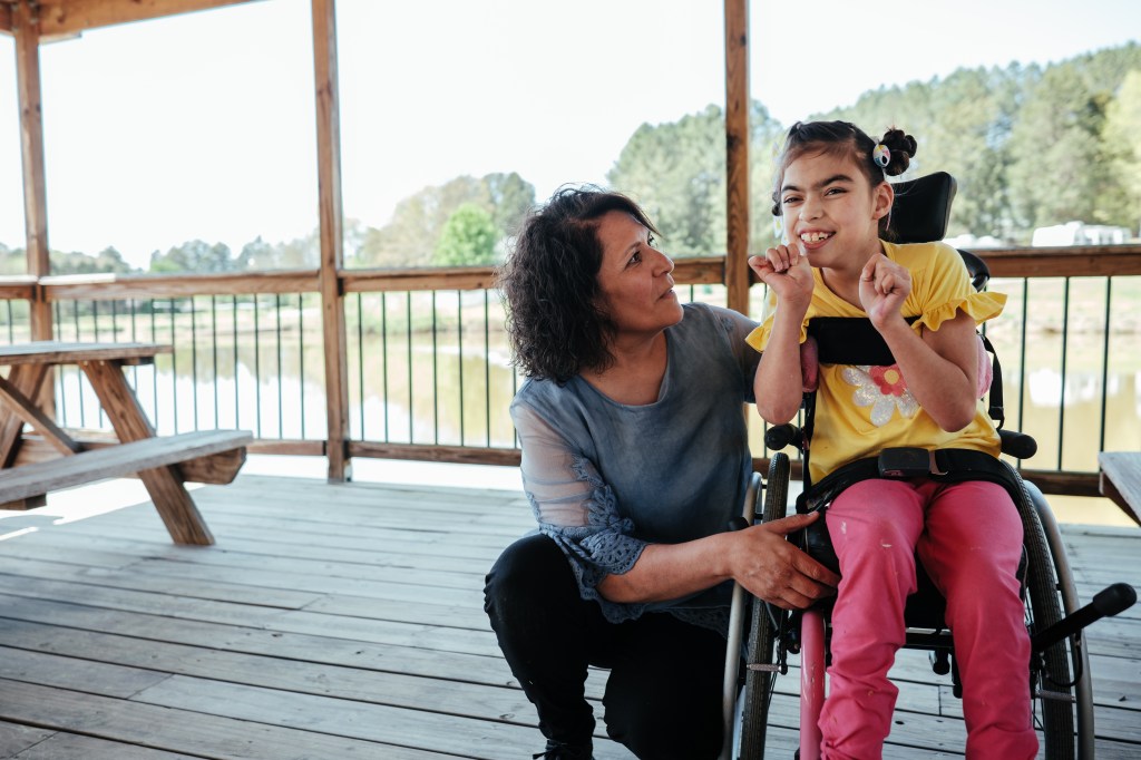 Yesenia and her daughter Miki share a family moment. Yesnia is Miki's caregiver.